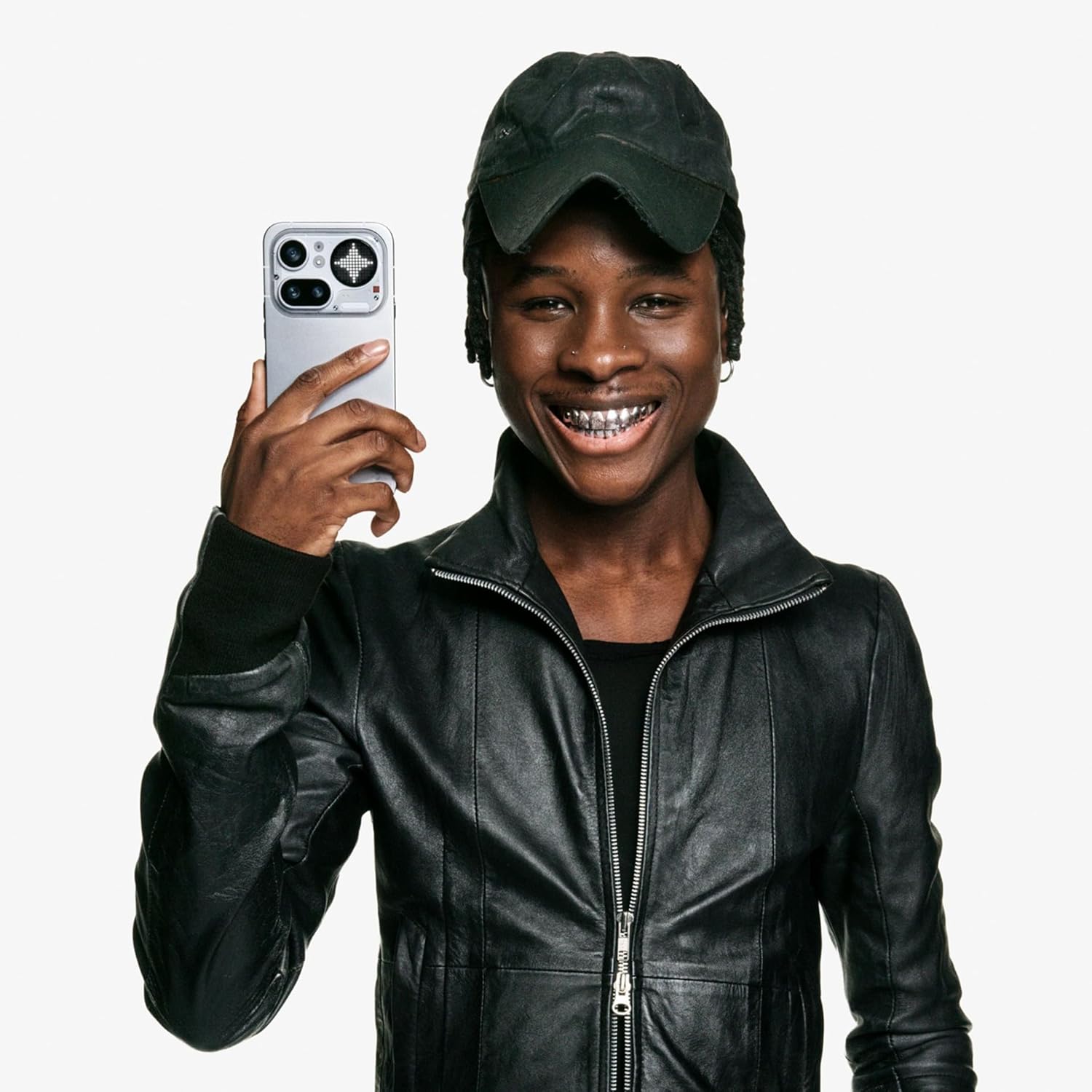 Person holding Nothing Phone 4a Pro 5G with silver/white back and Glyph camera module
