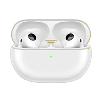 White charging case with earbuds, gold trim; black mic grilles visible