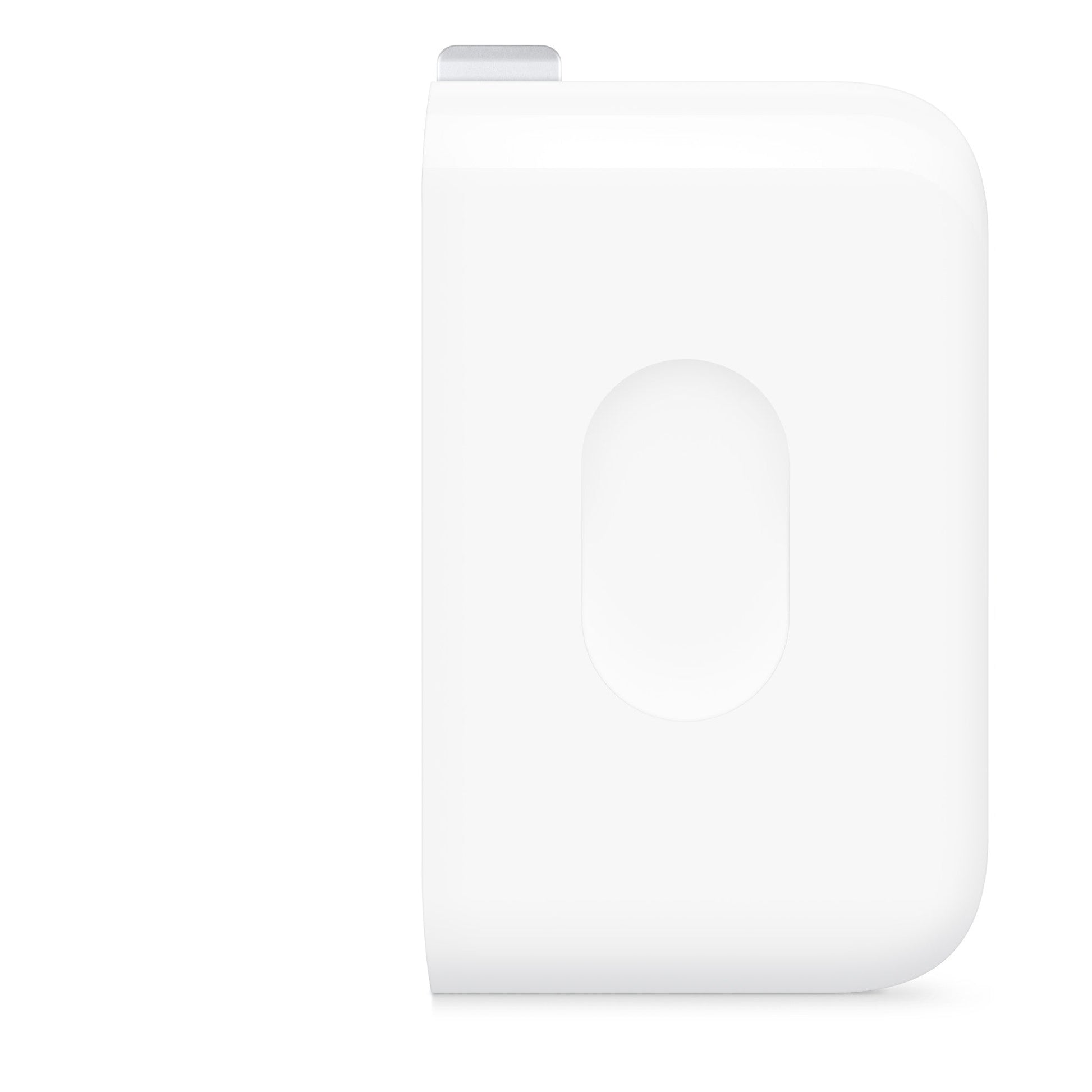 White wall power adapter block, oval icon panel on front