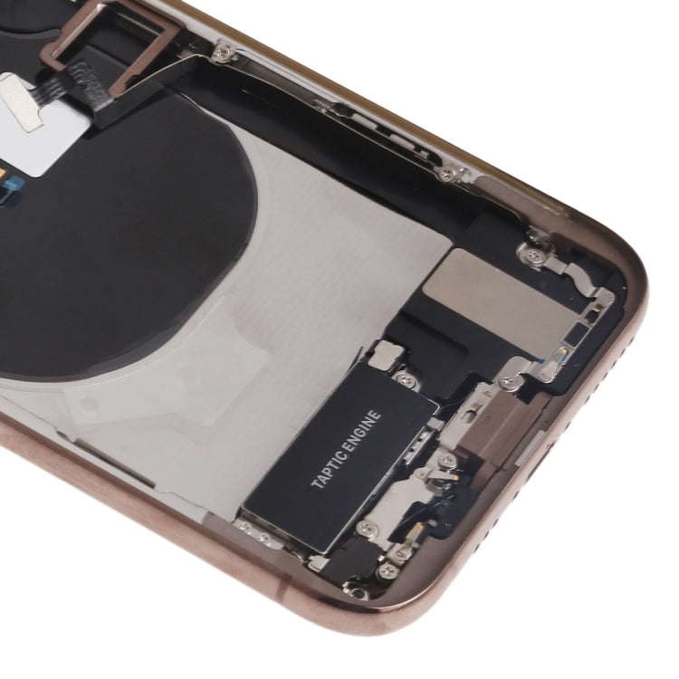 iPhone XS gold housing assembly close-up: bottom frame with charging port area