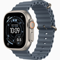 Smartwatch with natural titanium case and dark blue sport band, side buttons visible