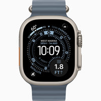 Smartwatch with natural titanium case and light blue sport band, rugged front view