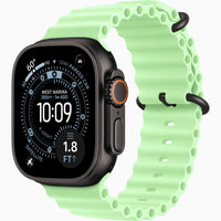 Apple Watch Ultra smartwatch with neon green perforated sports band and black lugs