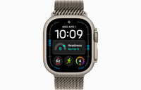 Black titanium smartwatch with gray Milanese loop band, watch face with activity icons