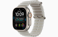 Apple Watch Ultra 4 smartwatch with Ocean Band, silver case, translucent off-white band.