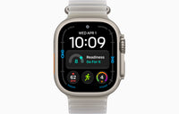 Ultra 4 smartwatch with Ocean Band, dark case, translucent light gray band.