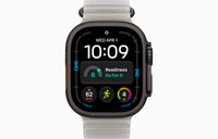 Ultra 4 smartwatch with Ocean Band, dark case, translucent light gray band.