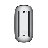 Mouse underside in light gray with Apple logo and oval charging port