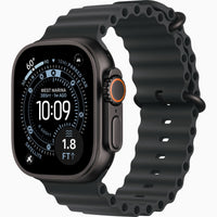 Apple Watch Ultra 3 with dark case and blue silicone Ocean band, back-to-front angle