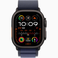 Apple Watch Ultra 2 with navy Alpine Loop band, dark case, digital watch face display